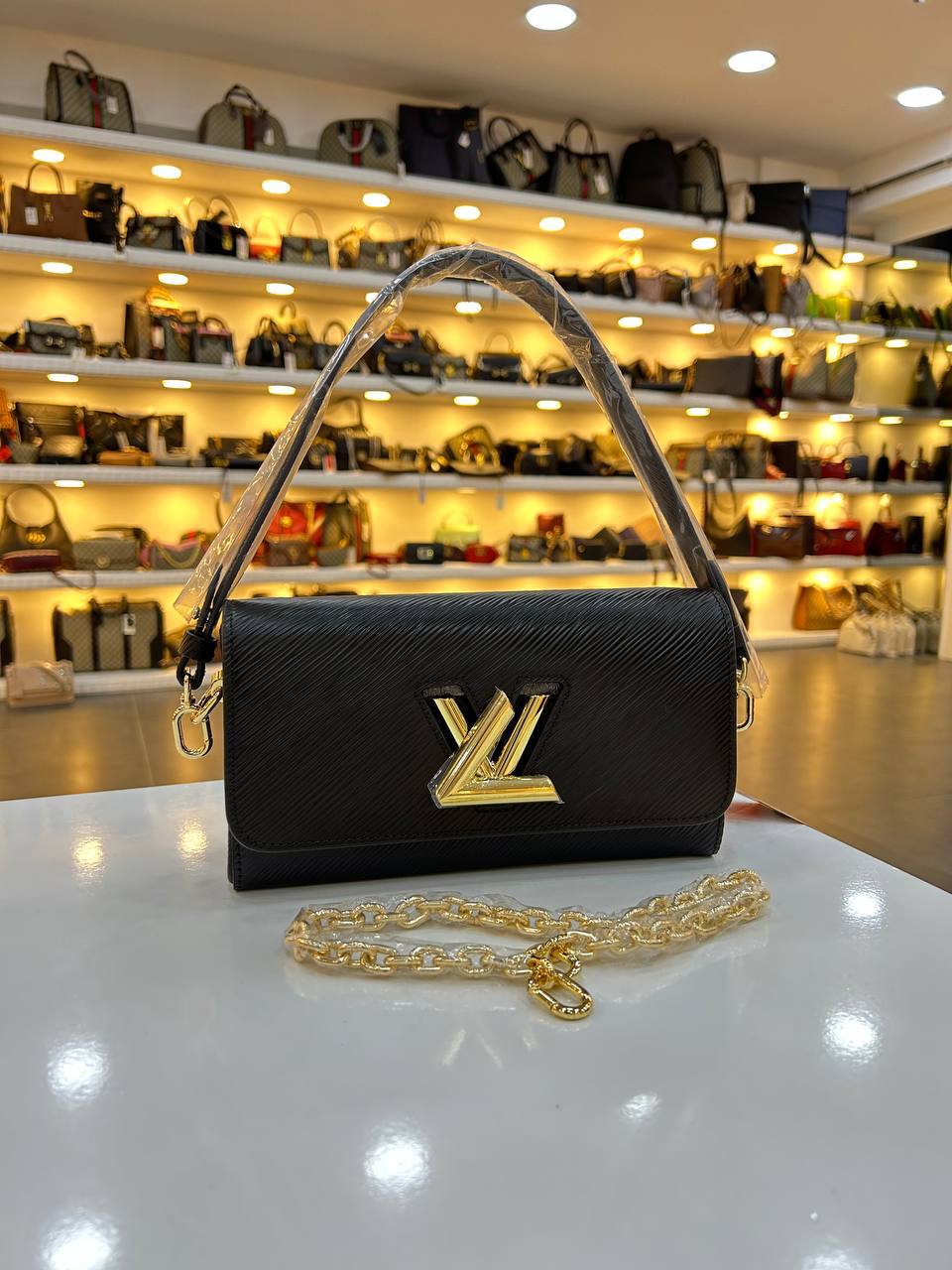 LOUIS VUITTON TWIST CLUTCH